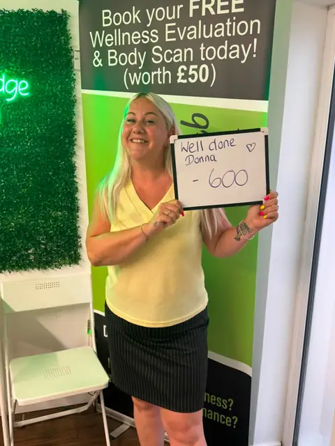 A Bamber Bridge Nutrition club member with her assessment board