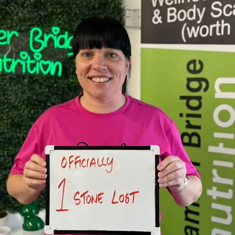 A Bamber Bridge Nutrition club member with her assessment board